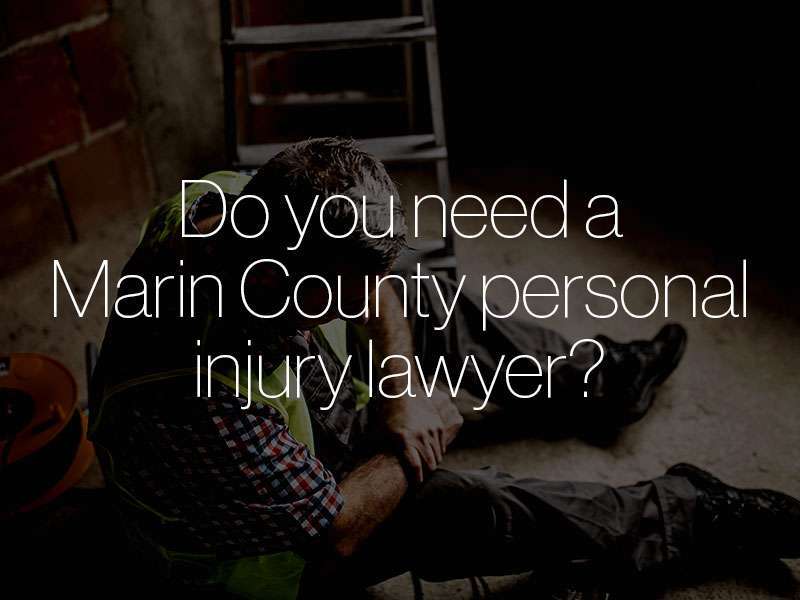 An injured construction worker clutching his wrist with the text "Do you need a Marin County personal injury lawyer?" superimposed