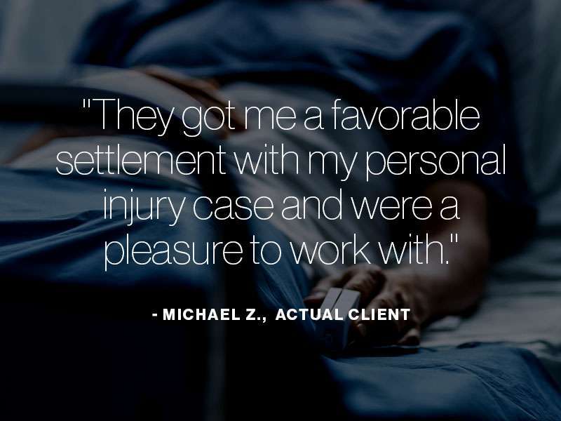 A man laying in a hospital bed with the text "They got me a favorable settlement with my personal injury case and were a pleasure to work with. - Michael Z., actual client" superimposed